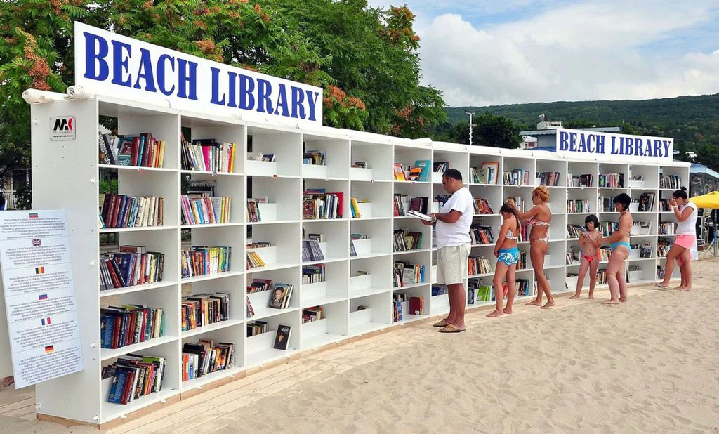 image from Albena Beach Library, located in a resort on the Black Sea coast, Bulgaria, is the first of its kind open air library in EU, boasting 6k+ books in 15+ languages. With 140 white shelves made from a special material and a vinyl cover, the library is resistant to sun, wind and rain.
