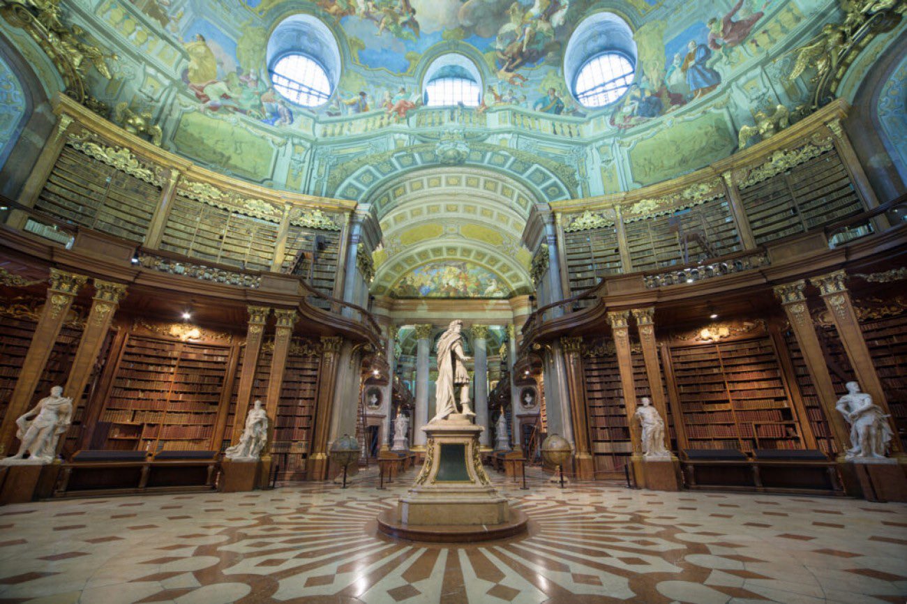 image from With 12+ million items, Austrian National Library is the largest library in Austria. Built in the 18th as the Imperial Court Library, the complex include the baroque State Hall Library, crowned by an intricately decorated dome, and 4 museums with special collections & archives.