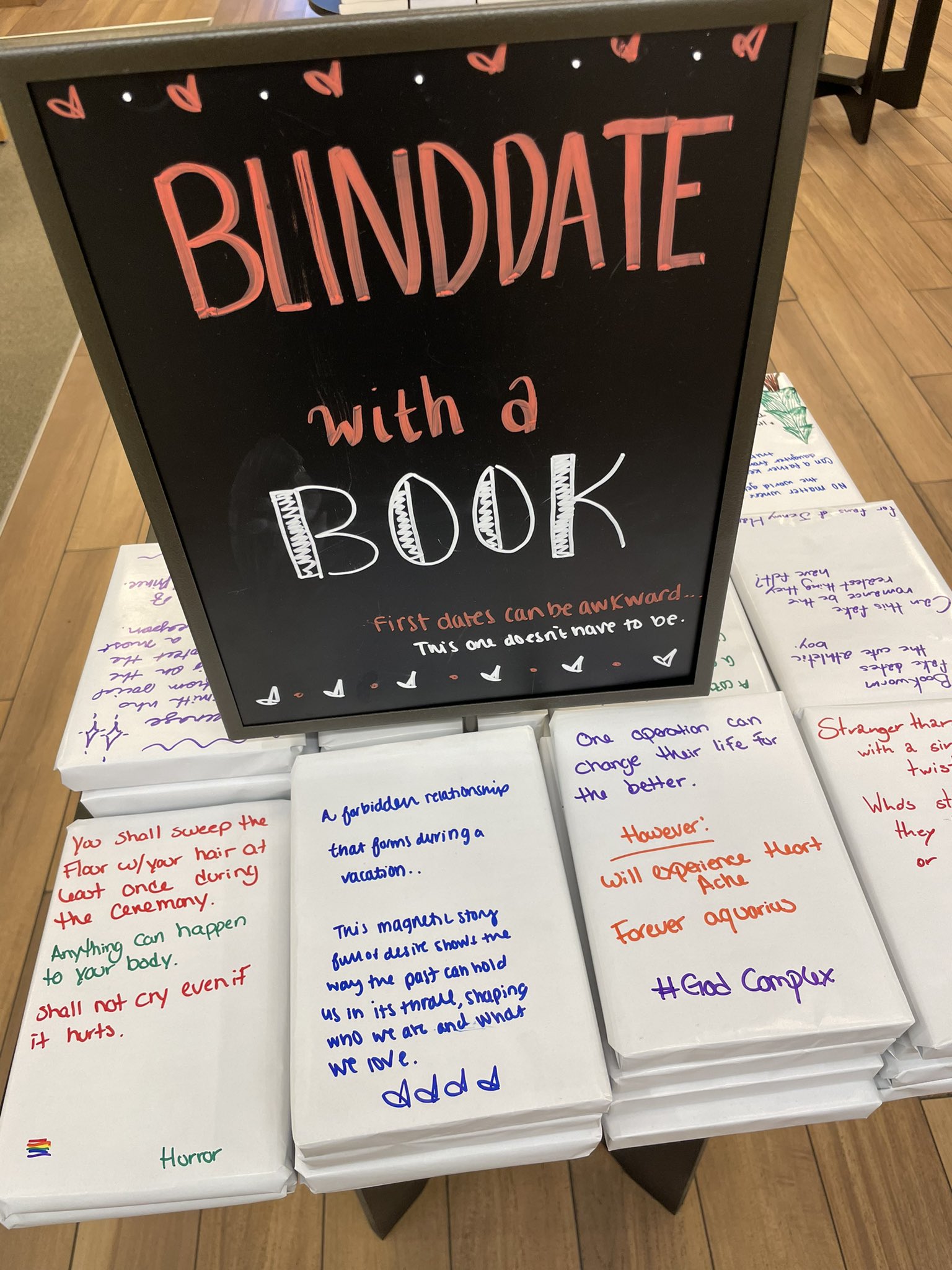 image from Blind Date With A Book is a concept started by a second-hand bookshop in Sydney, Australia. Each book is wrapped in brown paper, with only a few clues written on top. A reader picks and reads a book based solely on the clues, not by judging the book by its cover, title or author.